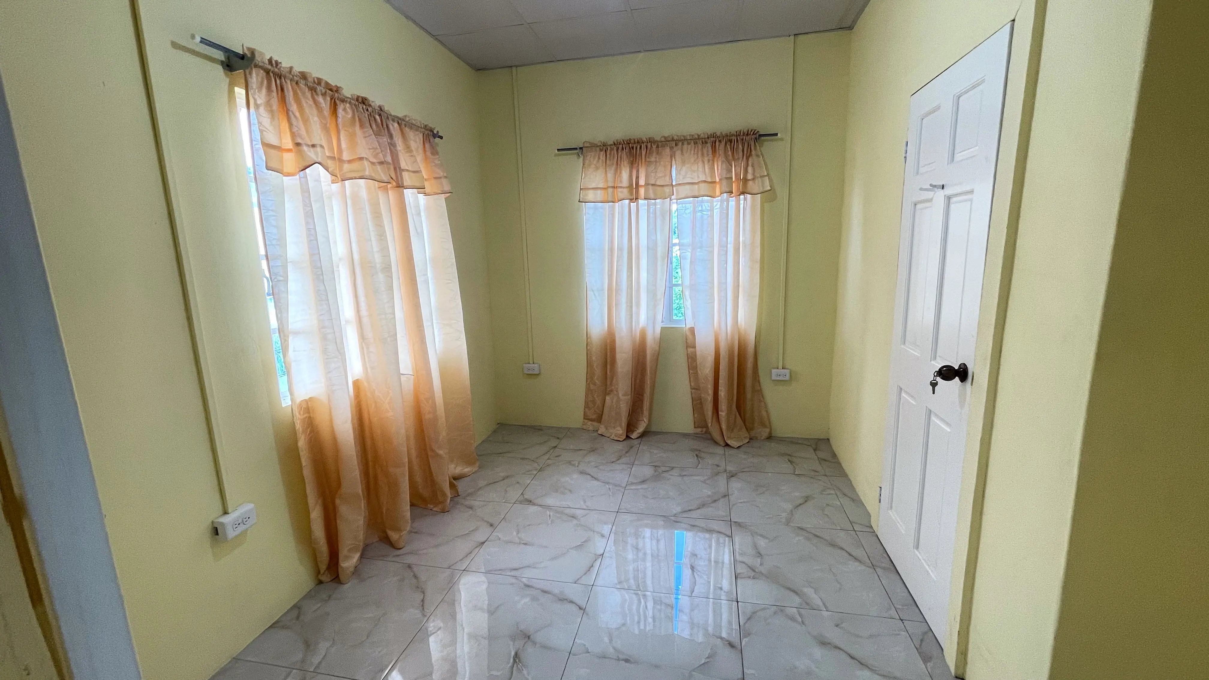 Spacious second bedroom in upstairs Champs Fleurs rental apartment