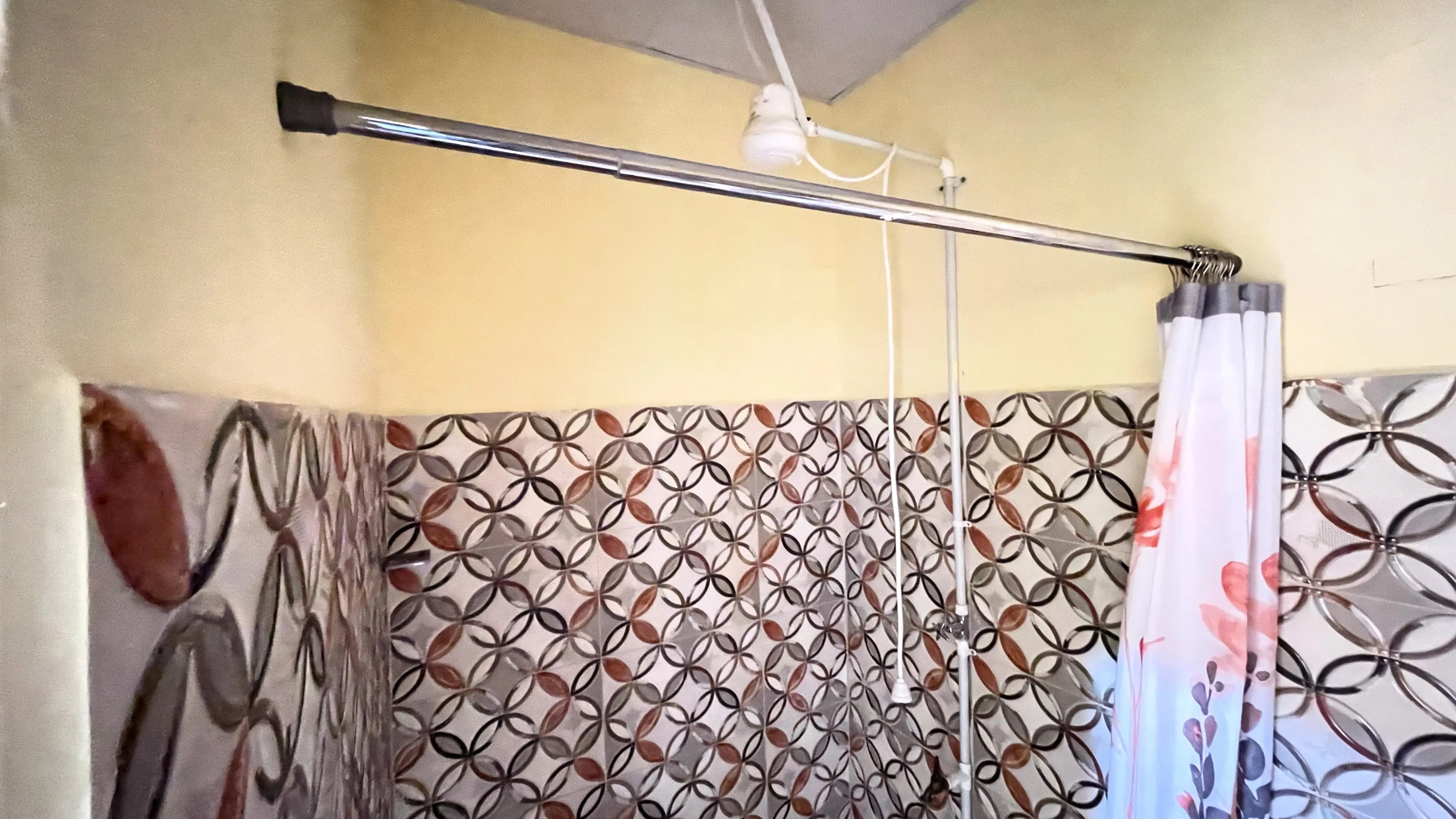Private ensuite bathroom with shower in two-bedroom Champs Fleurs apartment