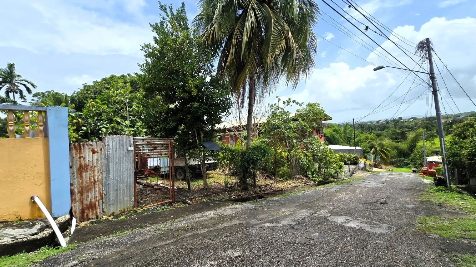 ST. JULIEN VILLAGE PRINCES TOWN VACANT LAND STREET VIEW LEFT