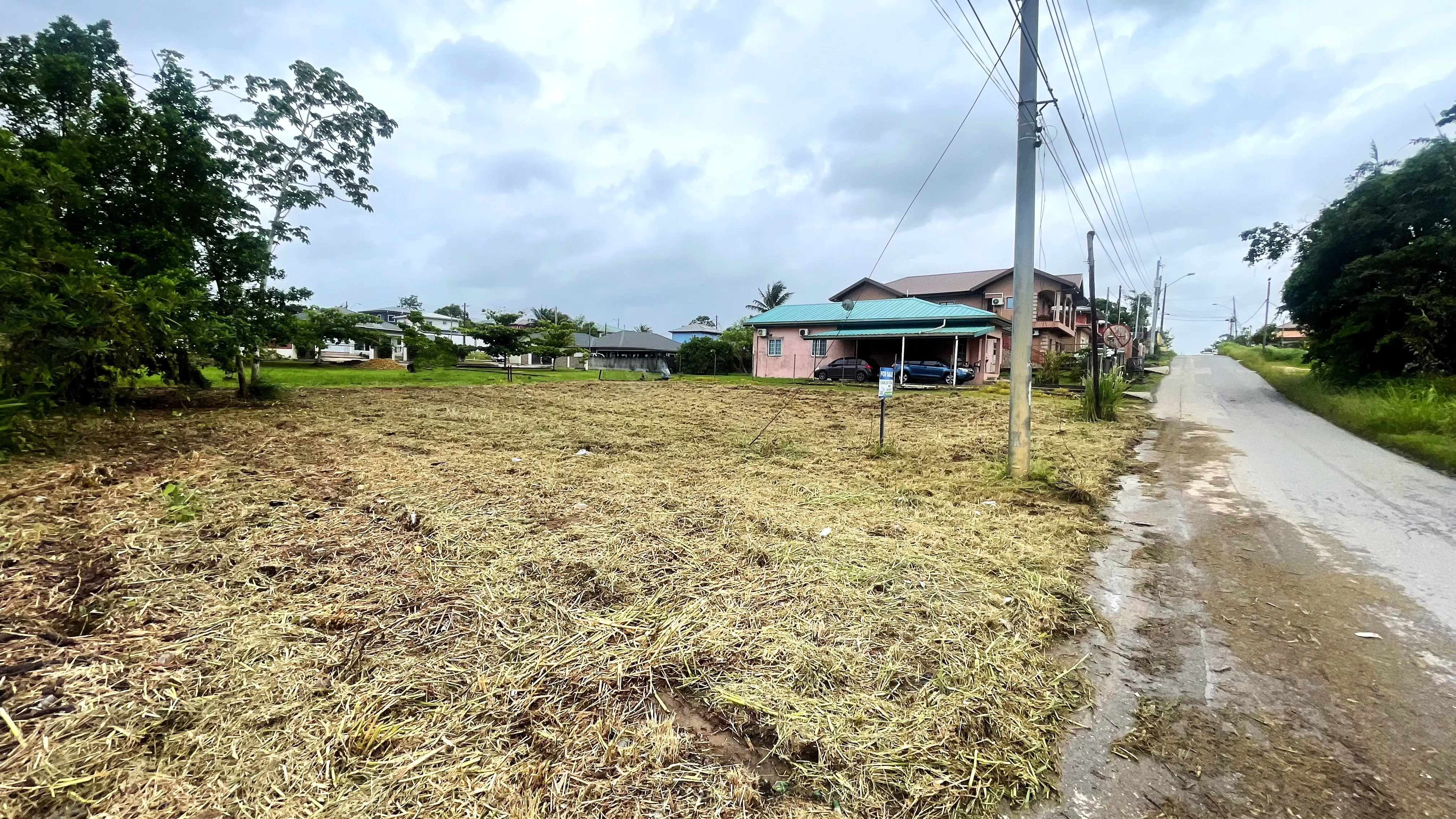 Wide view of 5,905 sq. ft. residential lot on Boy Cato Road, Cunupia