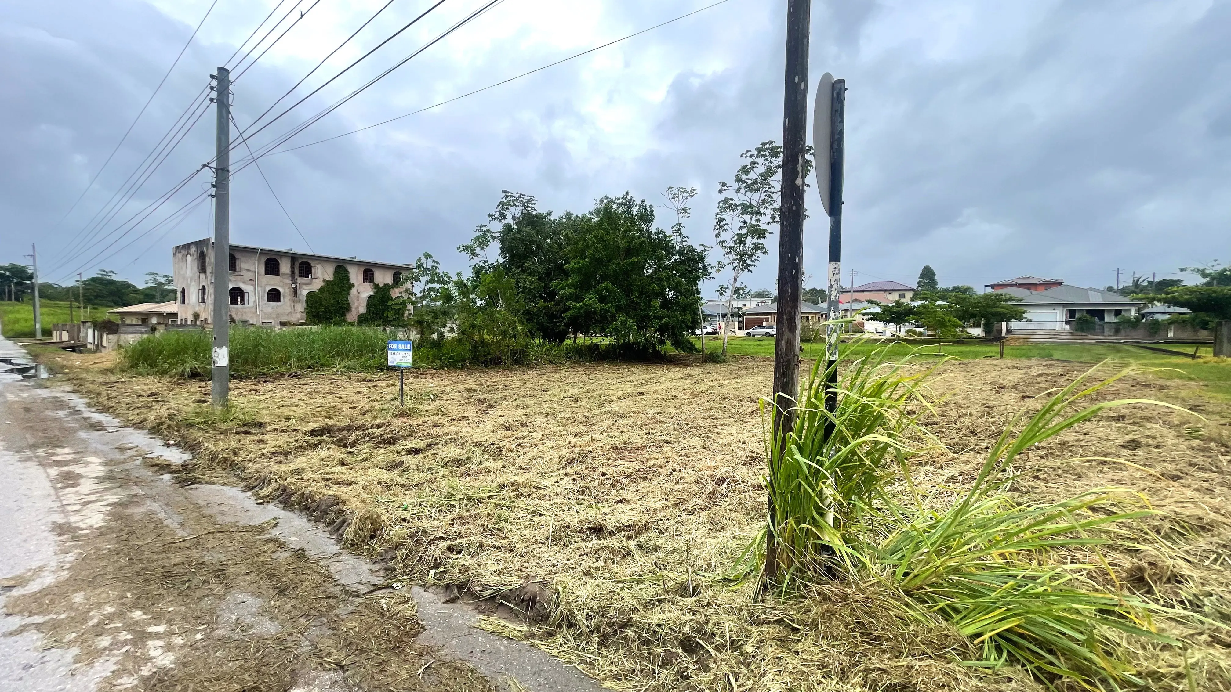 Eastern Side view of flat and cleared residential land in Madras Settlement, Cunupia