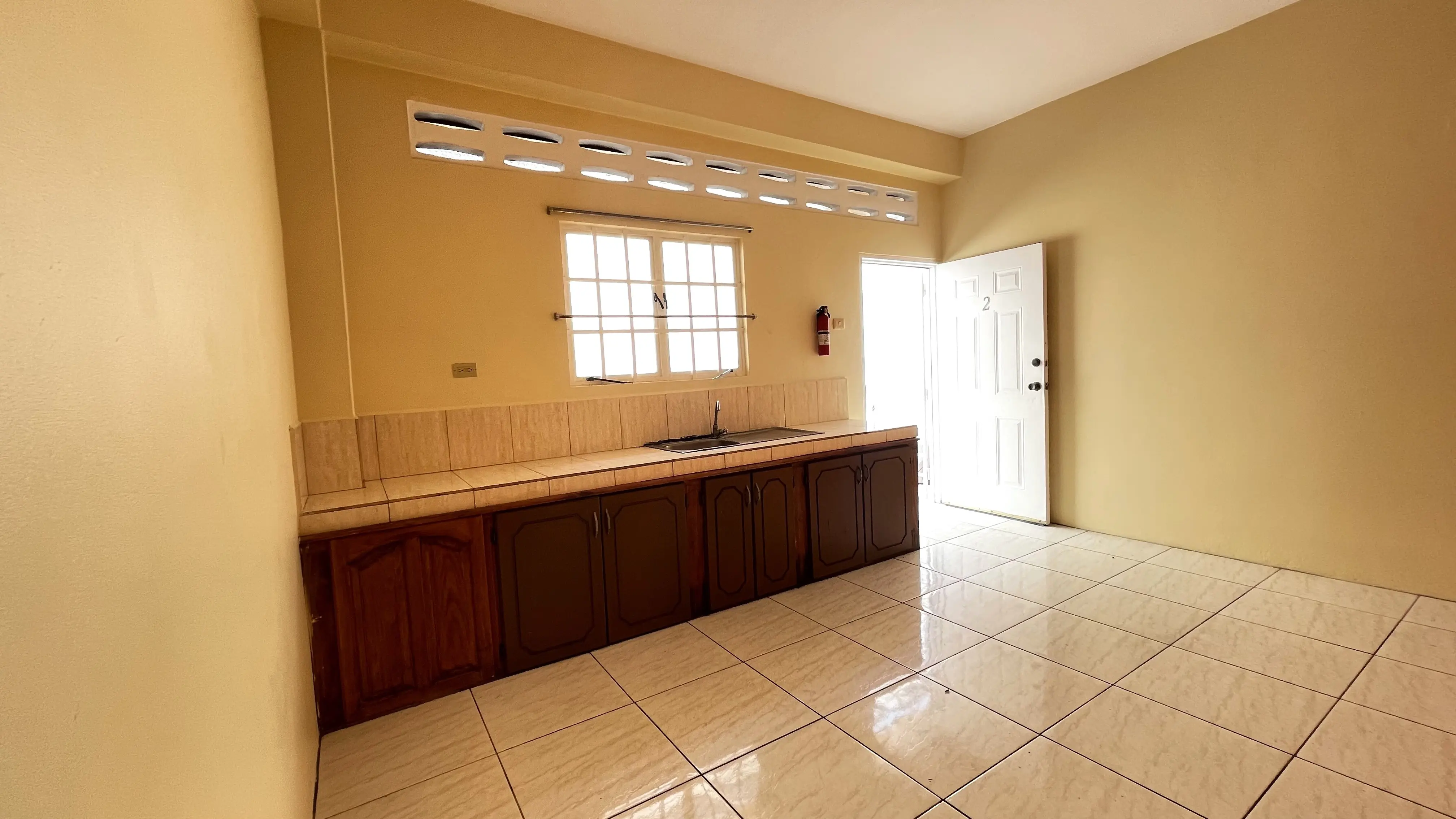 1-bedroom-apartment-bamboo-2-valsayn-kitchen-showing-entrance