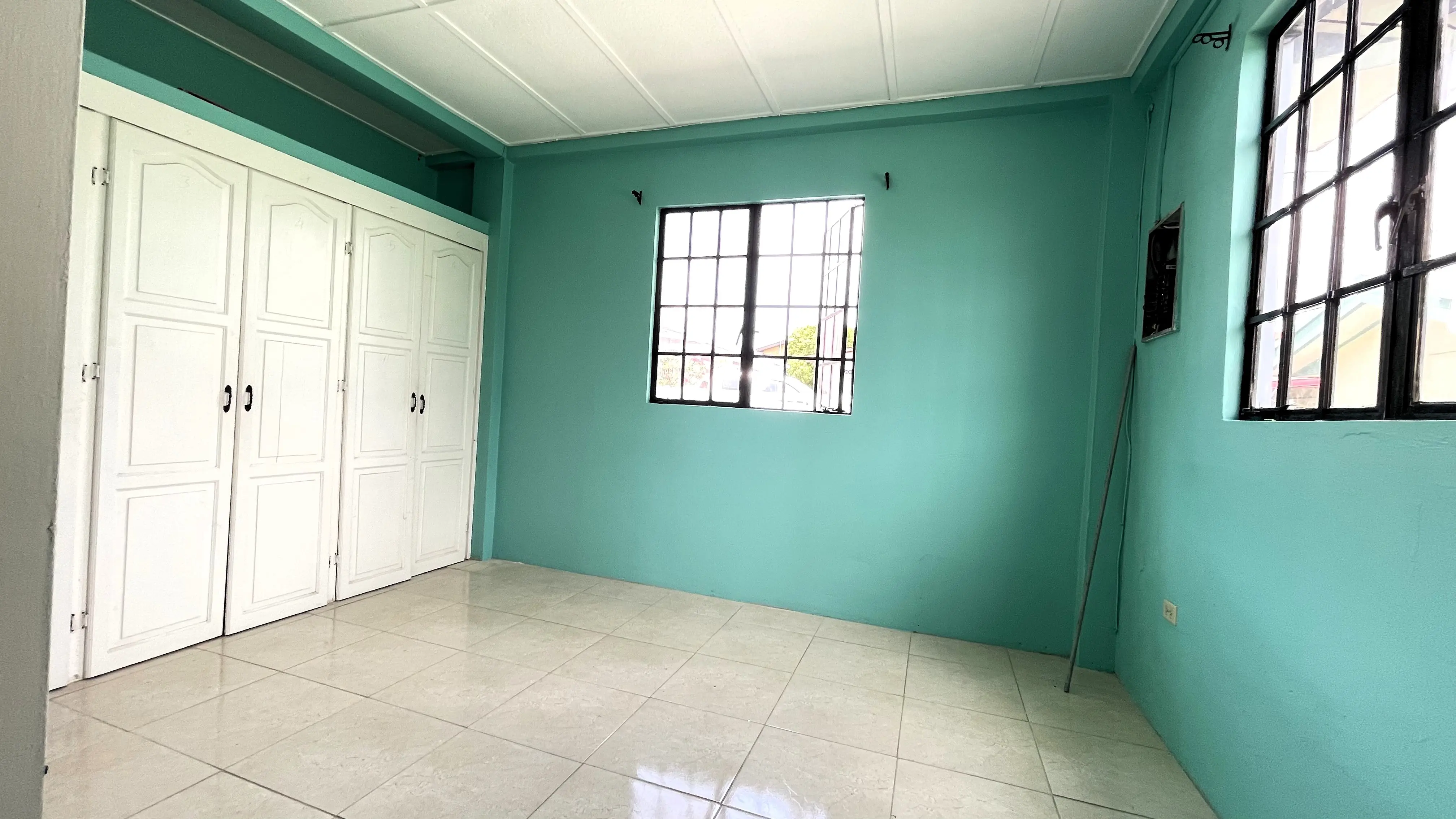 2-bedroom-tacarigua-rental-front-bedroom-with-cupboards